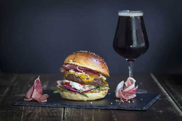 Delicious gourmet burger served at Kandalló Burger Pub, Budapest's top spot for craft burgers.